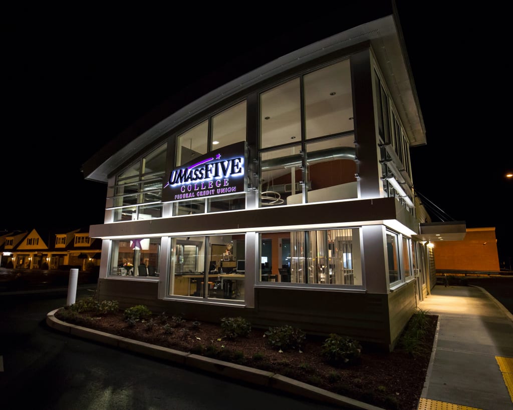 Two-storey commercial building lit at night