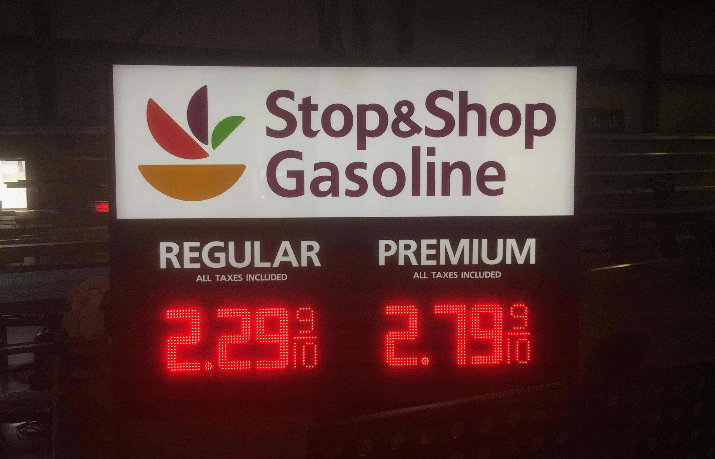Stop and Shop Gasoline LED price sign glowing red at night