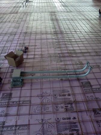 A conduit sweep and boxes tied into slab reinforcing mesh
