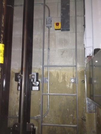 Conduit and a disconnect mounted on an interior wall
