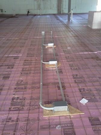 Conduit stubbed up through slab reinforcing mesh before the pour
