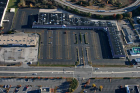 Aerial view of a large striped retail parking lot in Seekonk, Massachusetts