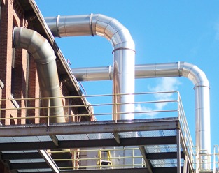 Galvanized duct bends above a steel platform