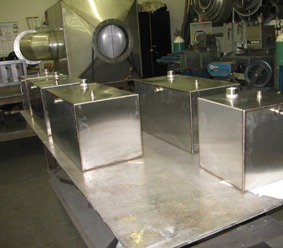 Fabricated stainless steel tanks on the shop bench