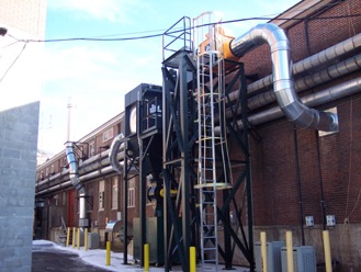 Dust collector and ducting installed against a brick plant