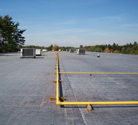 Rooftop units and piping on a flat roof