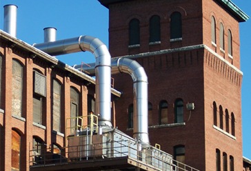Exhaust stacks and duct risers on a brick mill