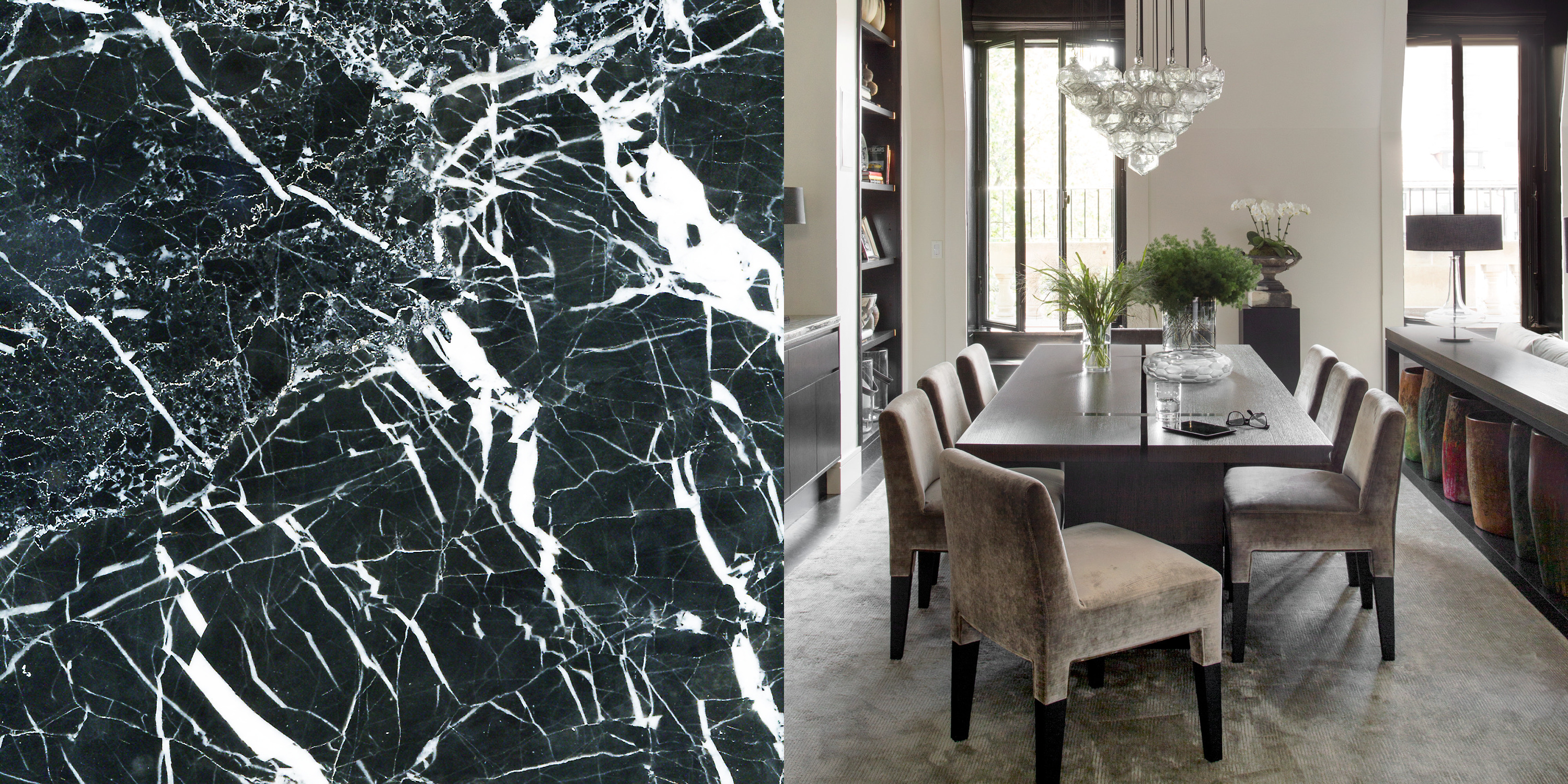 A dining room with a dark timber table, upholstered chairs, built in shelving and a glass chandelier