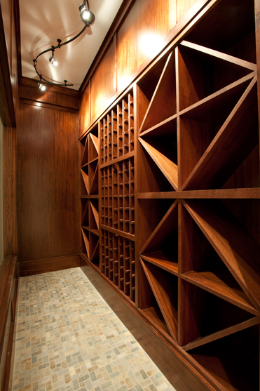 Wine cellar with diamond lattice racking and a stone floor