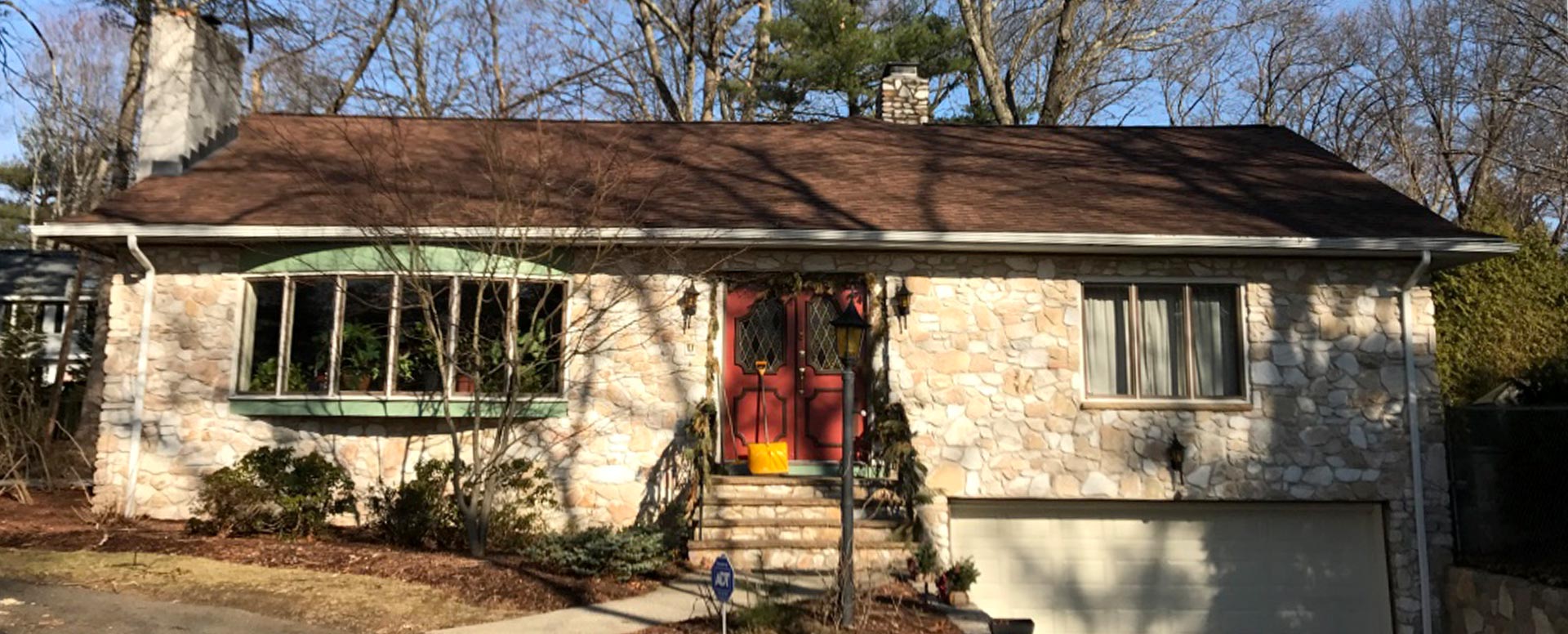 Stone-front ranch house with a new roof