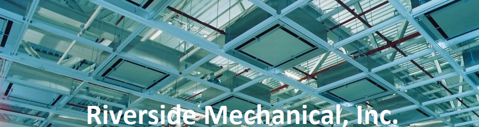 Open plenum above a suspended ceiling grid, with lighting and structural steel