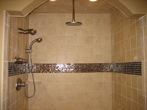 Tiled shower with a glass mosaic band running through the tile