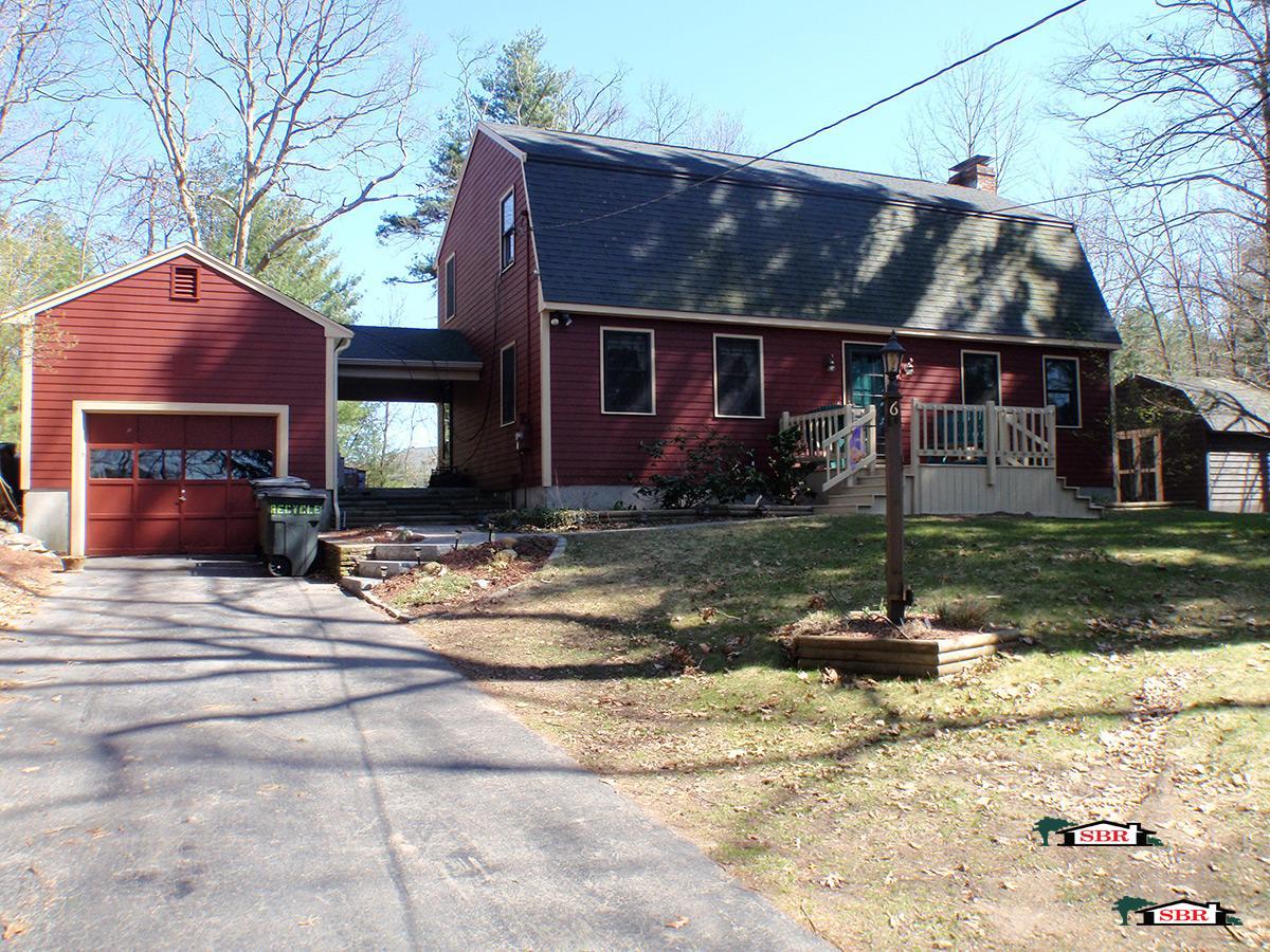 Red cape with a detached garage after remodeling