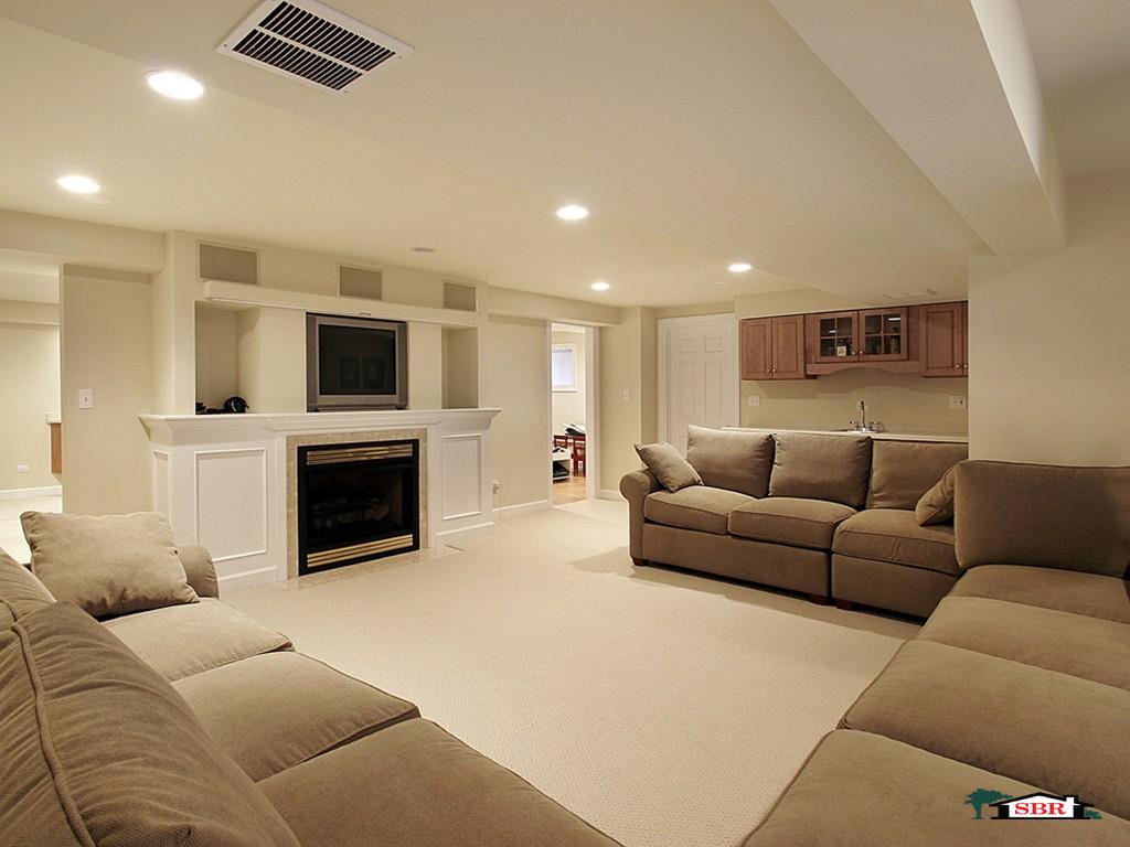 Finished basement family room with built-ins around a fireplace