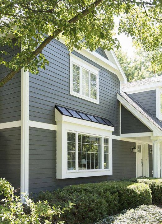 Lap siding and white trim on a two story home exterior