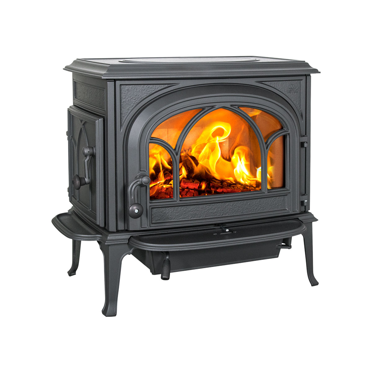 Wood stove with a fire burning behind the arched glass door
