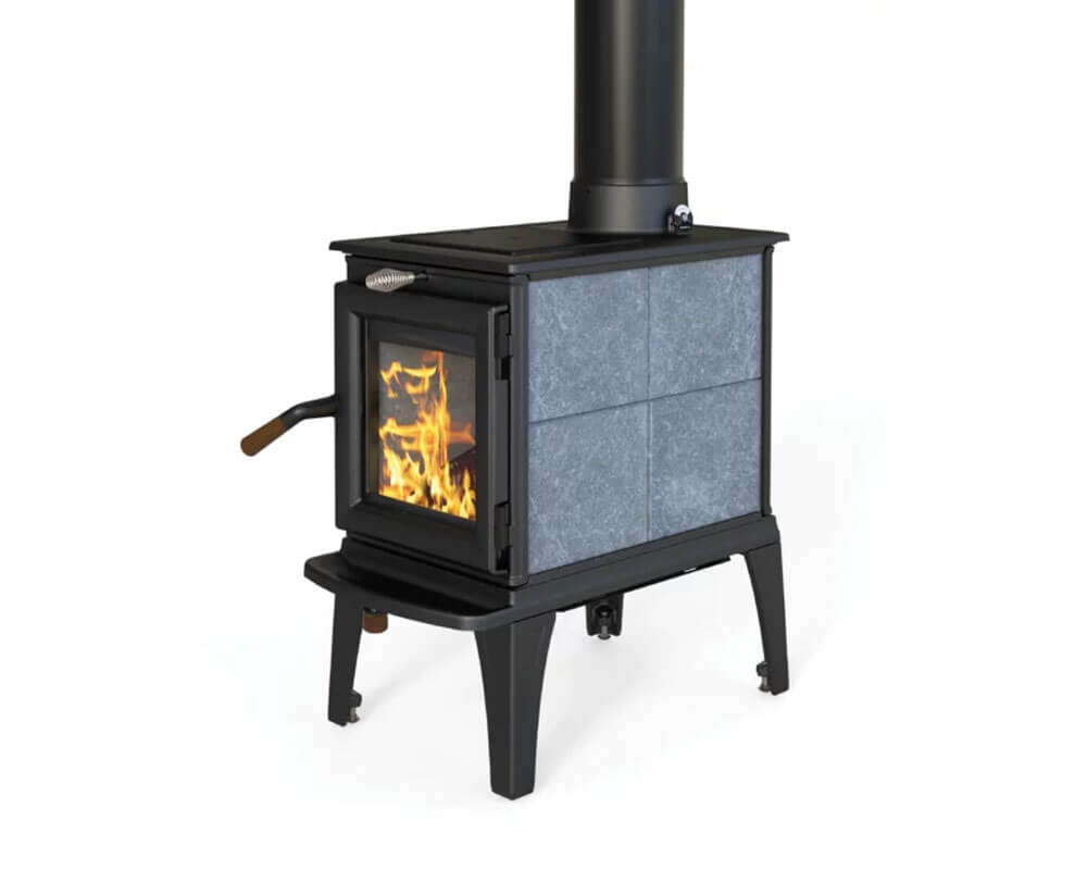 Stone sided wood stove with a lit fire and a black flue pipe